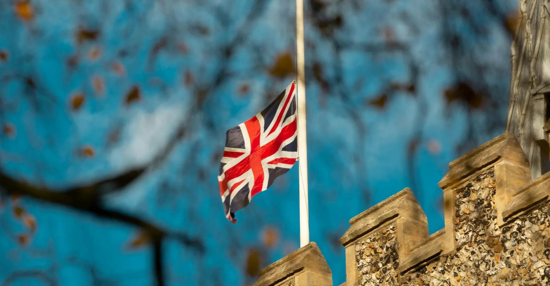 Union flag flying above a British building
